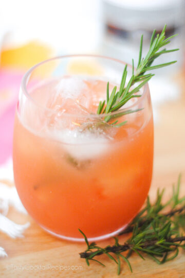 greyhound cocktail made with grapefruit juice and a sprig of rosemary.