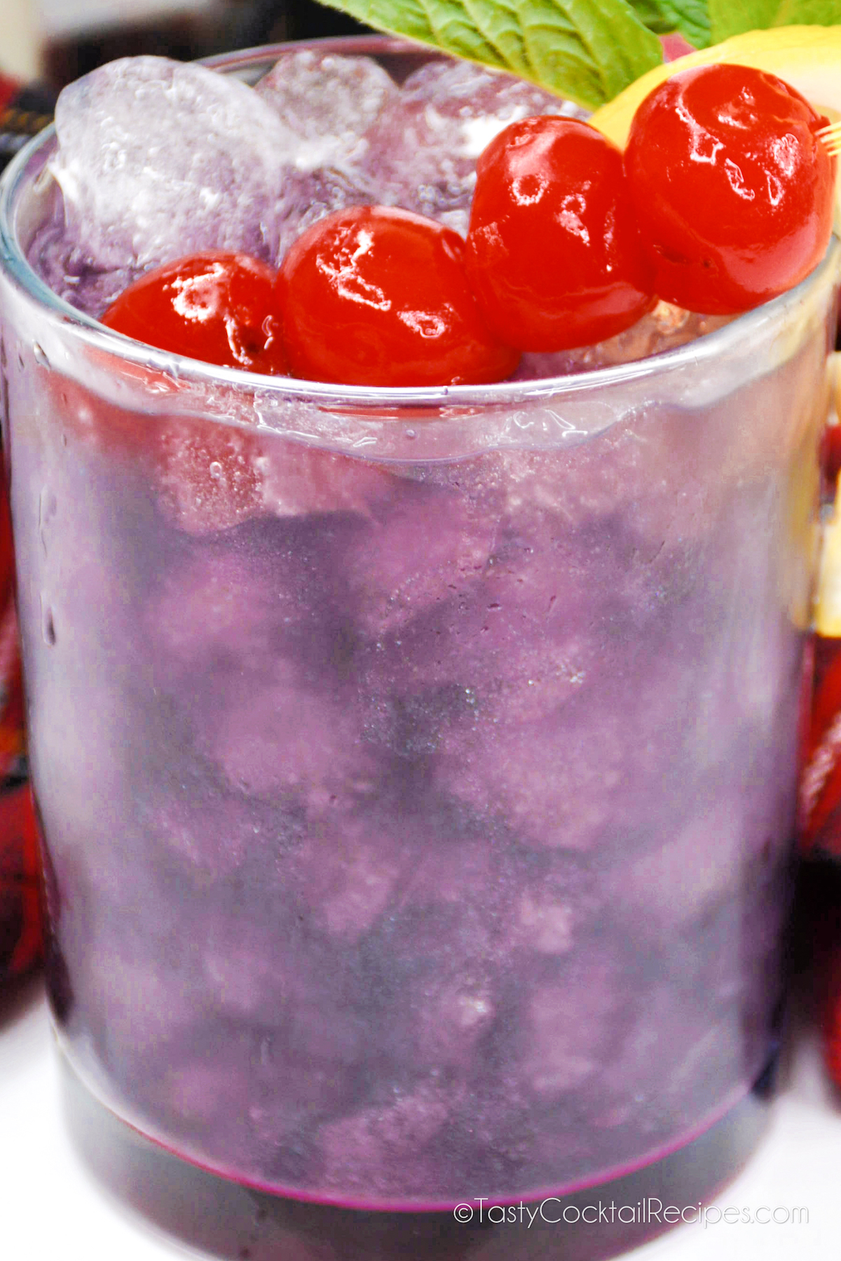 close up of a bright violet Purple Rain Cocktail.